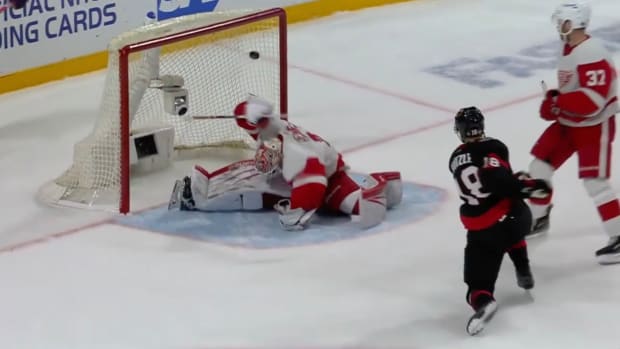 James Reimer ducks as the puck flies into the net